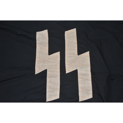 361 - A WWII Second World War Third Reich Nazi German SS flag. Black ground with stitched SS runes. Faint ... 