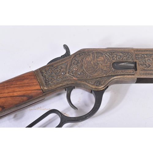 378 - A vintage replica US United States style Winchester rifle. Hexagonal barrel with hunting scenes on t... 