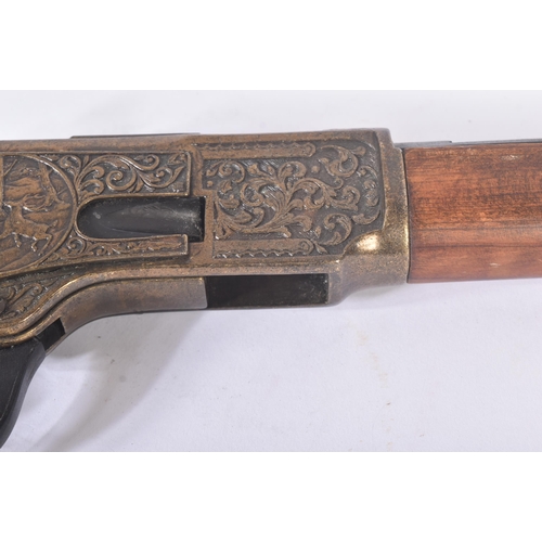 378 - A vintage replica US United States style Winchester rifle. Hexagonal barrel with hunting scenes on t... 