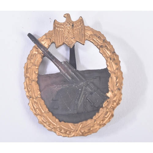 393 - A WWII Second World War Third Reich Nazi German Kriegsmarine Coastal Artillery war badge. The centra... 