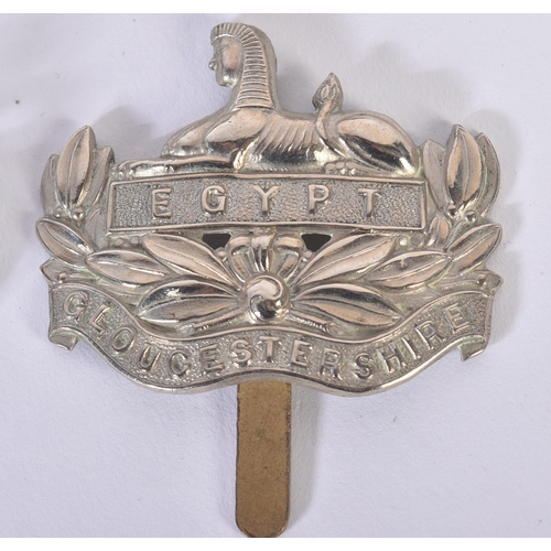 397 - A WWII Second World War medal group and a selection of cap badges comprising Royal Tank Regiment and... 