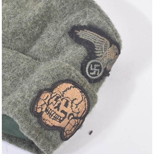 402 - A WWII Second World War Third Reich Nazi German Waffen SS enlisted mans side cap. The cap with embro... 