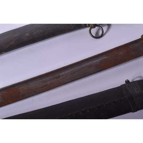 403 - Two 19th Century North African Tuareg / Hausa people Takoba swords. Tooled leather scabbards with wh... 