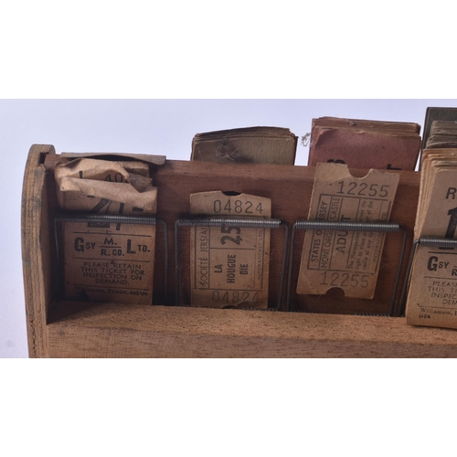 42 - A collection of early 20th Century vintage coach / bus tickets together with a wooden spring mounted... 