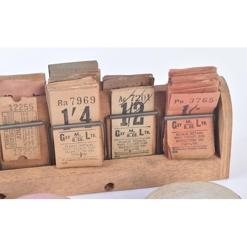 42 - A collection of early 20th Century vintage coach / bus tickets together with a wooden spring mounted... 