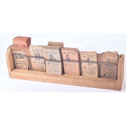 42 - A collection of early 20th Century vintage coach / bus tickets together with a wooden spring mounted... 