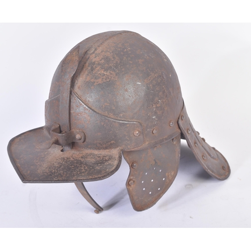 420 - A 19th Century copy of a post-Renaissance lobster-tailed pot helmet. The helmet having a rounded sku... 