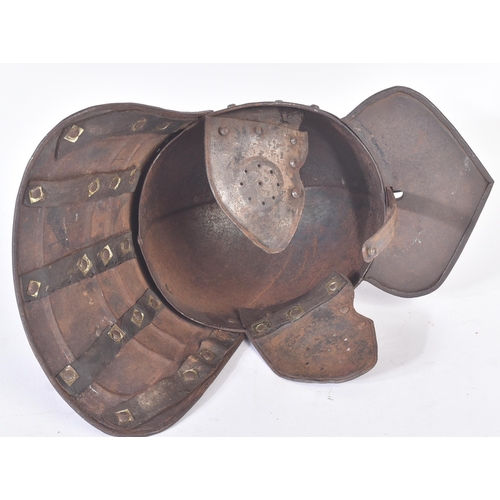 420 - A 19th Century copy of a post-Renaissance lobster-tailed pot helmet. The helmet having a rounded sku... 