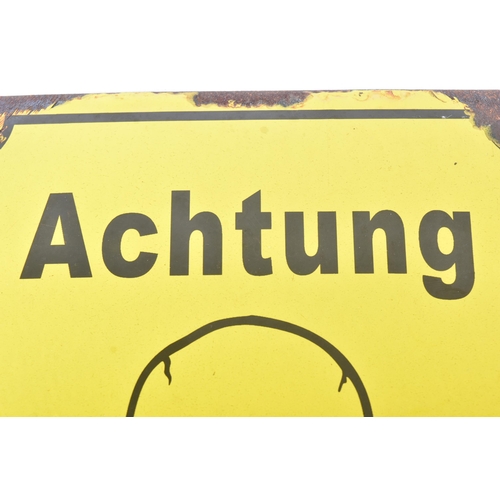 426 - A WWII Second World War Third Reich Nazi German enamel sign. Yellow with a black ' Achtung Minen! ' ... 