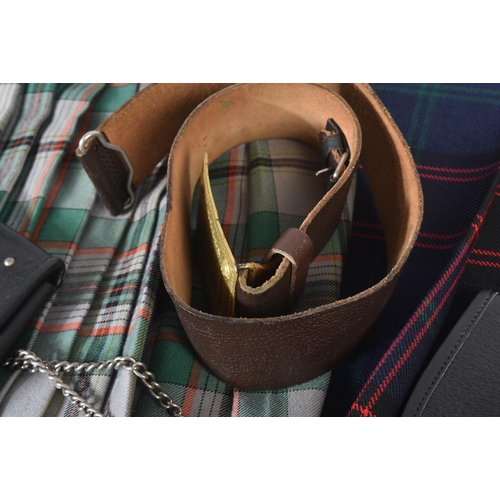 447 - Two vintage Scottish Highland style kilts along with x2 leather sporrans and a brown leather belt wi... 