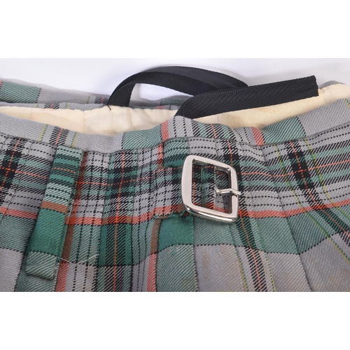 447 - Two vintage Scottish Highland style kilts along with x2 leather sporrans and a brown leather belt wi... 