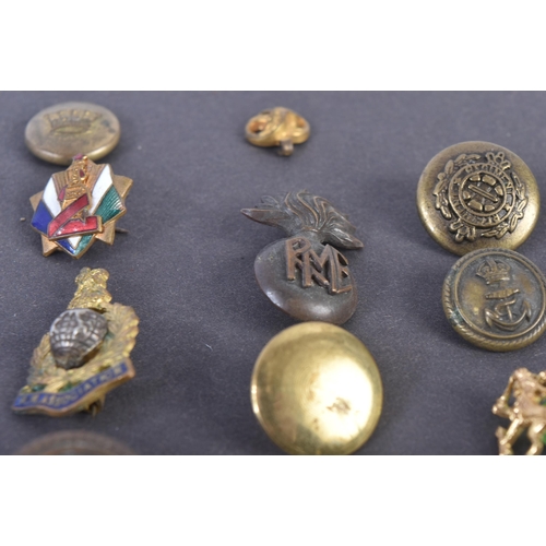 59 - A collection of assorted 20th Century (WWII and surrounding period) military related buttons, badges... 