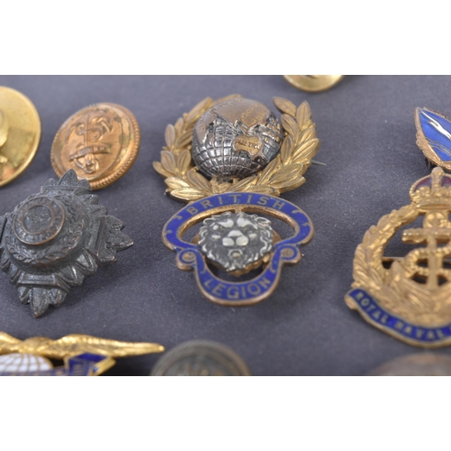 59 - A collection of assorted 20th Century (WWII and surrounding period) military related buttons, badges... 