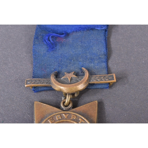 64 - A 19th Century Egypt Campaign Khedive's Star medal with Tokar clasp. The five-pointed bronze star sh... 