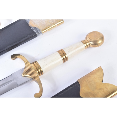 69 - Two contemporary replica ' Blackfriars Daggers '. Solid brass dome pommel hilt, polished bone grip a... 