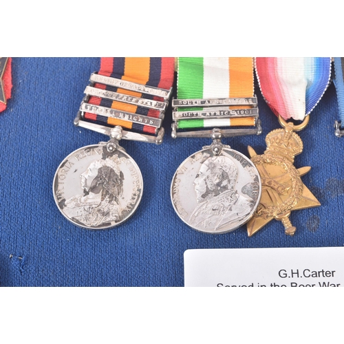 7 - A Boer War and WWI First World War medal group awarded to one G. H. Carter who served in the Kings R... 