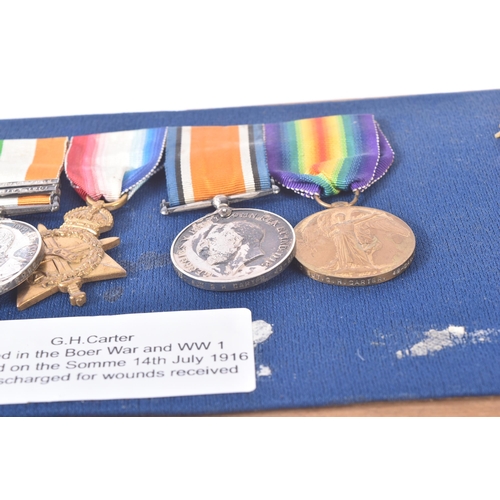 7 - A Boer War and WWI First World War medal group awarded to one G. H. Carter who served in the Kings R... 