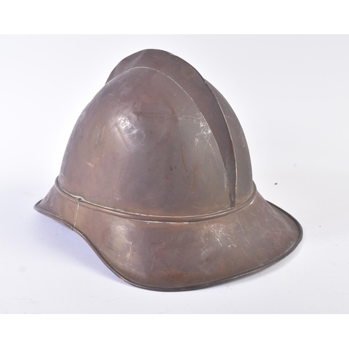 86 - A late 19th Century French Adrian helmet. The helmet of usual form split pin ' comb ' through the to... 