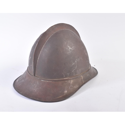 86 - A late 19th Century French Adrian helmet. The helmet of usual form split pin ' comb ' through the to... 