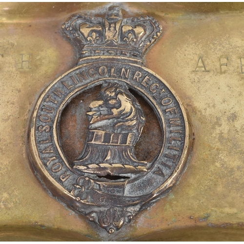 94 - A Boer War interest brass moulded tray with a fixed Royal South Lincolnshire Militia cap badge. Stam... 