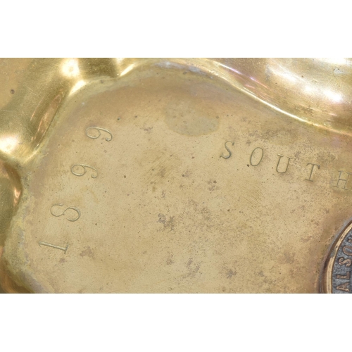 94 - A Boer War interest brass moulded tray with a fixed Royal South Lincolnshire Militia cap badge. Stam... 