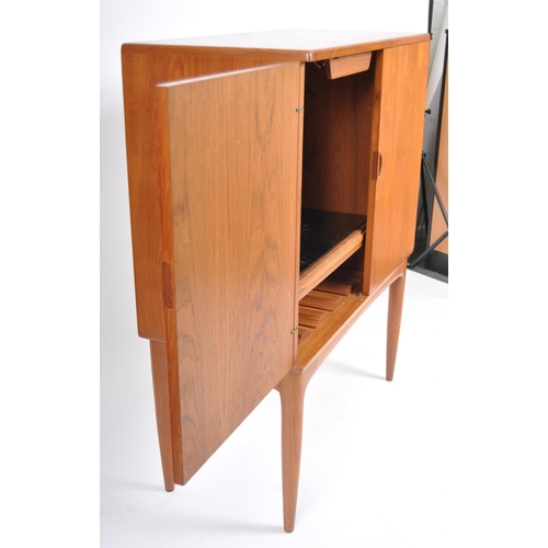 30 - A retro vintage mid 20th Century 1960s Danish teak cocktail drinks cabinet having two full length do... 