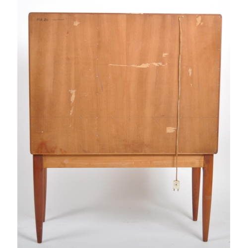 30 - A retro vintage mid 20th Century 1960s Danish teak cocktail drinks cabinet having two full length do... 