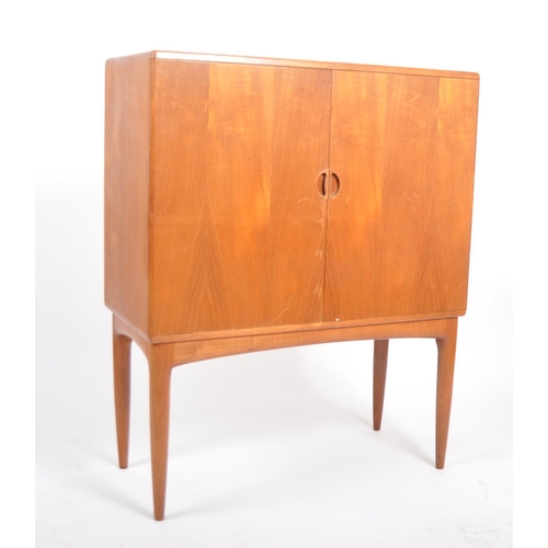 30 - A retro vintage mid 20th Century 1960s Danish teak cocktail drinks cabinet having two full length do... 