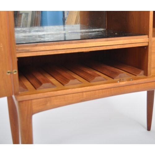 30 - A retro vintage mid 20th Century 1960s Danish teak cocktail drinks cabinet having two full length do... 