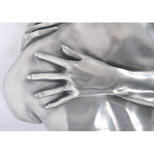 31 - Compulsion Gallery Of Bromley - A contemporary pewter layered life size embraced couple wall hanging... 