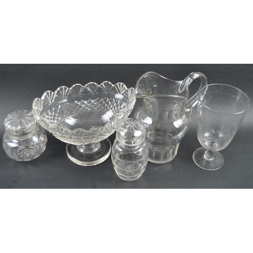 192 - A collection of 19th Century cut glassware to include a large pitcher jug, large conical bowl vase /... 