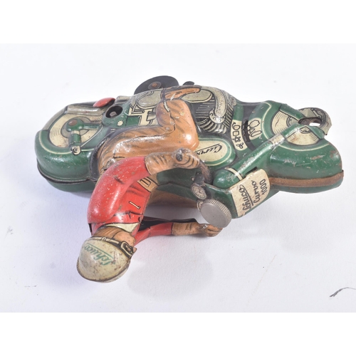 103 - A vintage 1950s Schuco made tinplate clockwork model of a motorcycle ' Curvo 1000 '. Green with red/... 