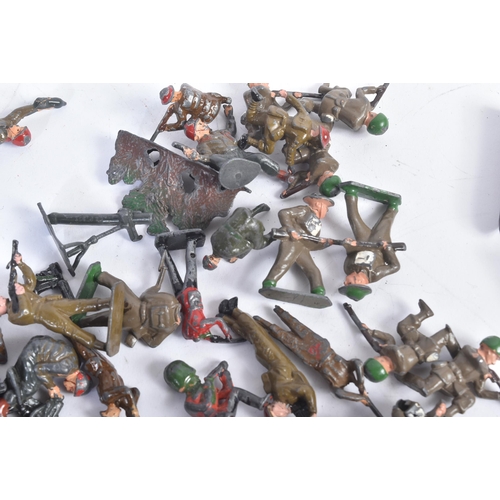 22 - A collection of assorted vintage, likely Britain's made, lead toy soldiers. Various examples of sold... 