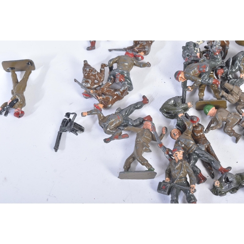 22 - A collection of assorted vintage, likely Britain's made, lead toy soldiers. Various examples of sold... 