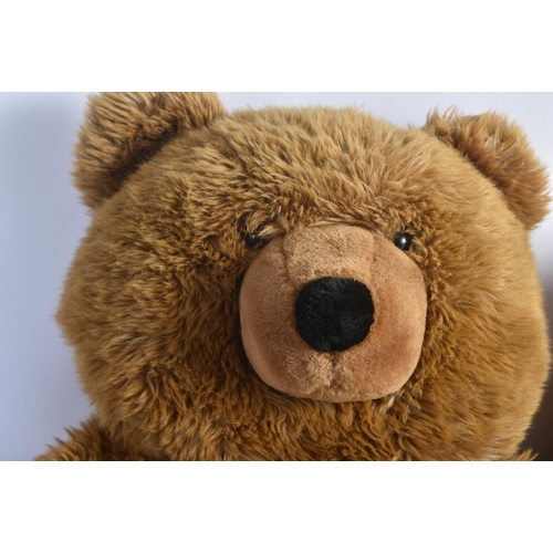 323 - Two large soft toy teddy bears to include x1 Russ Berrie example with red scarf. Brown plush fur wit... 