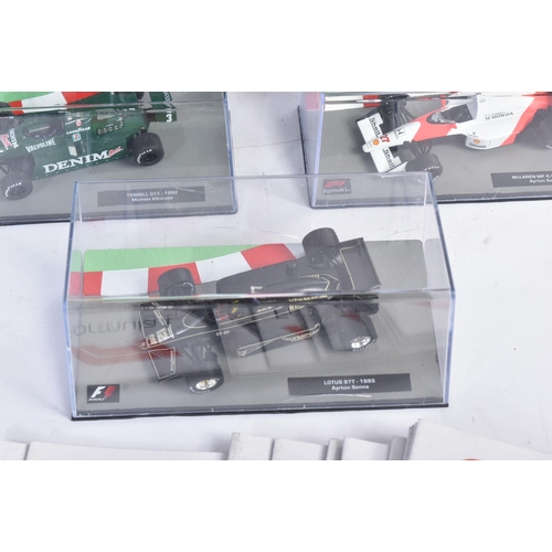 431 - A collection of 1/43 scale boxed diecast model cars of Formula One interest with accompanying magazi... 