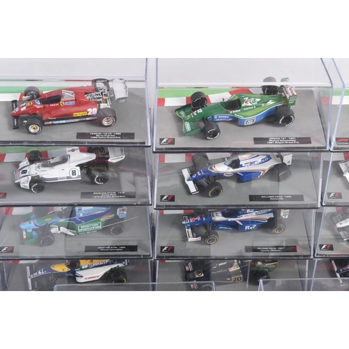 431 - A collection of 1/43 scale boxed diecast model cars of Formula One interest with accompanying magazi... 