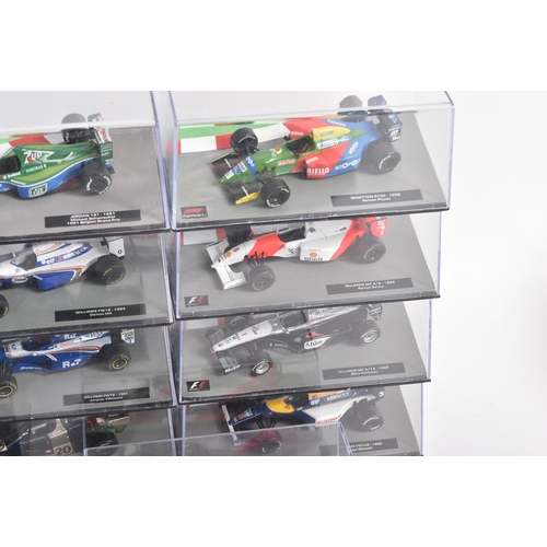 431 - A collection of 1/43 scale boxed diecast model cars of Formula One interest with accompanying magazi... 