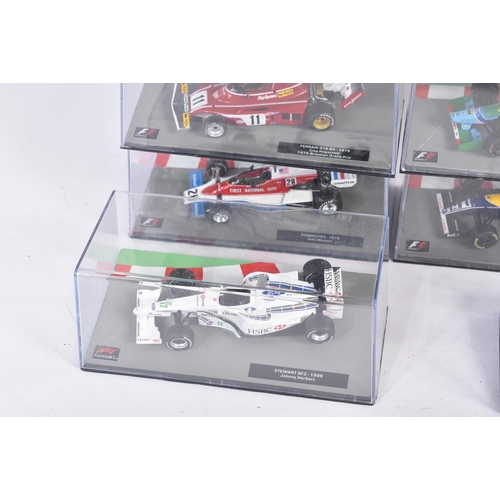 431 - A collection of 1/43 scale boxed diecast model cars of Formula One interest with accompanying magazi... 