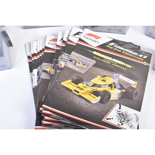 434 - A collection of 1/43 scale boxed diecast model cars of Formula One interest with accompanying magazi... 