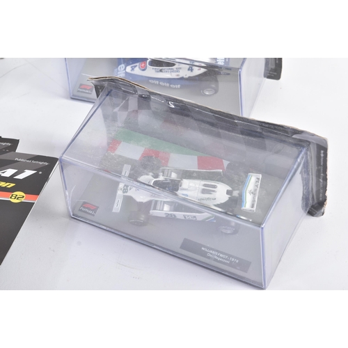 434 - A collection of 1/43 scale boxed diecast model cars of Formula One interest with accompanying magazi... 