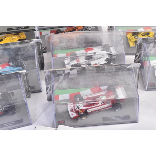 434 - A collection of 1/43 scale boxed diecast model cars of Formula One interest with accompanying magazi... 