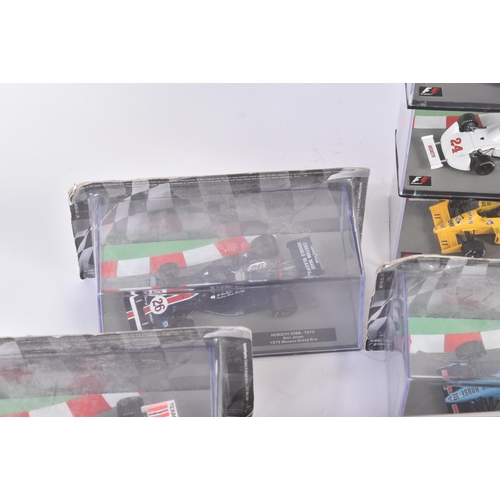 434 - A collection of 1/43 scale boxed diecast model cars of Formula One interest with accompanying magazi... 