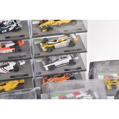 434 - A collection of 1/43 scale boxed diecast model cars of Formula One interest with accompanying magazi... 