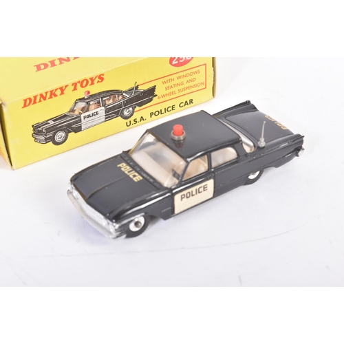 438 - Two vintage Dinky Toys boxed diecast model cars comprising; No. 258 USA Police Car and No. 256 Polic... 