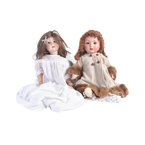 452 - Two early 20th Century German ( Schoenau & Hoffmeister ) bisque headed dolls. Both with flirty eyes,... 