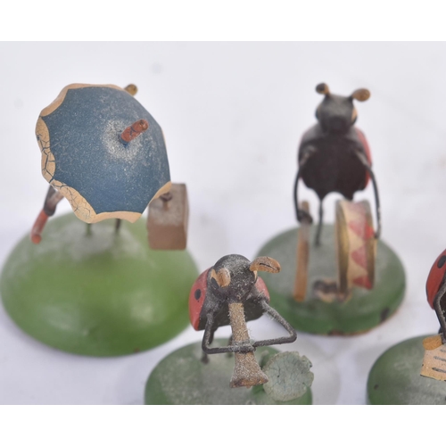 456 - A collection of vintage believed German made wooden miniature ladybird / ladybug figures. The hand p... 