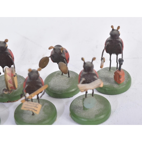 456 - A collection of vintage believed German made wooden miniature ladybird / ladybug figures. The hand p... 