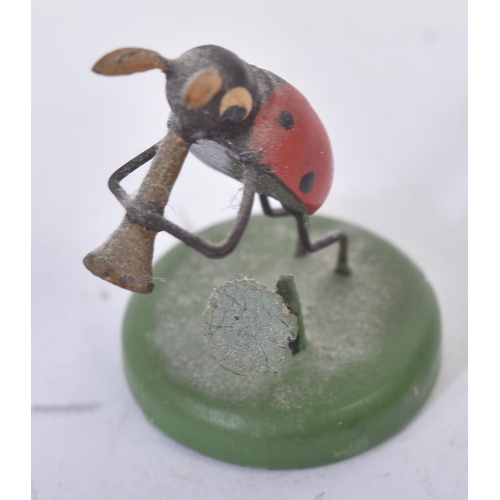 456 - A collection of vintage believed German made wooden miniature ladybird / ladybug figures. The hand p... 