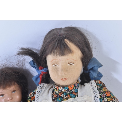 95 - Two early 20th Century German Kathe Kruse dolls. The smaller having bendable wire limbs and cloth bo... 